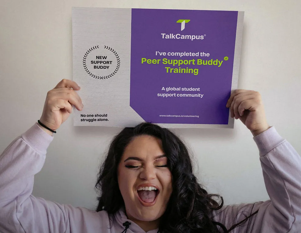 Student celebrating with Peer Support Buddy Training certificate